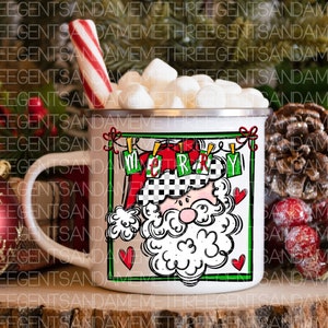 May include: White ceramic mug with a red and white Santa Claus design. The mug has a black handle and says "Merry" in a banner above Santa's head. The mug is filled with marshmallows and a red and white candy cane is leaning against the mug.