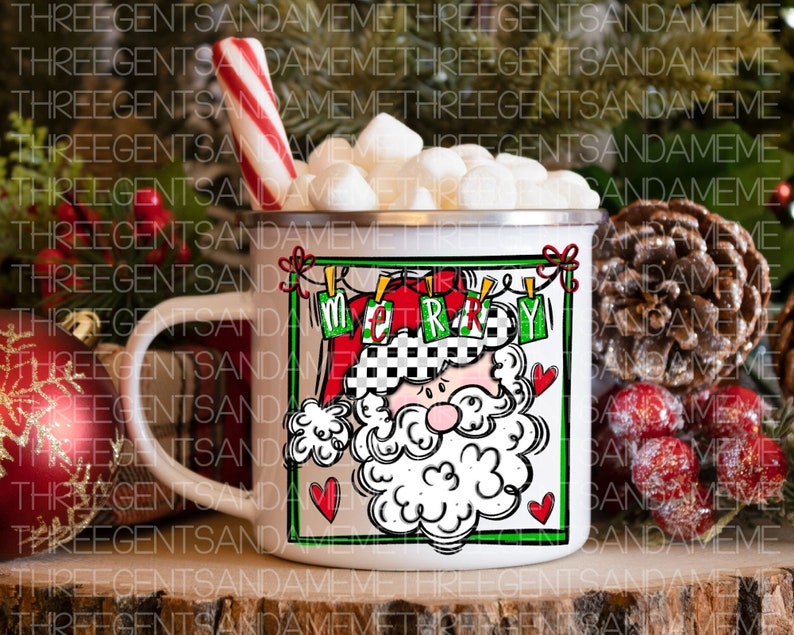 May include: White ceramic mug with a red and white Santa Claus design. The mug has a black handle and says "Merry" in a banner above Santa's head. The mug is filled with marshmallows and a red and white candy cane is leaning against the mug.