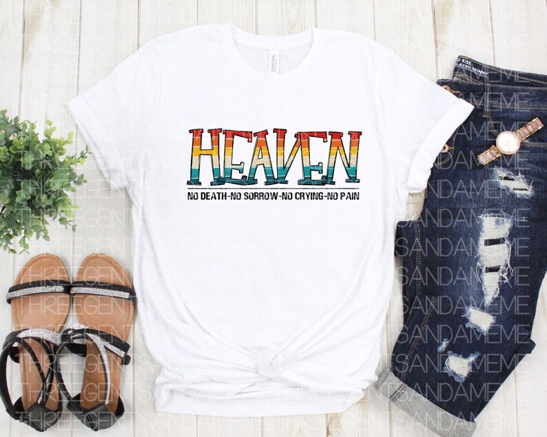 May include: White t-shirt with a retro-style graphic that says "HEAVEN" in rainbow colors. The text below the graphic says "NO DEATH-NO SORROW-NO CRYING-NO PAIN".