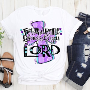 May include: White t-shirt with a purple cross and the text "For the battle belongs to you LORD" in black.
