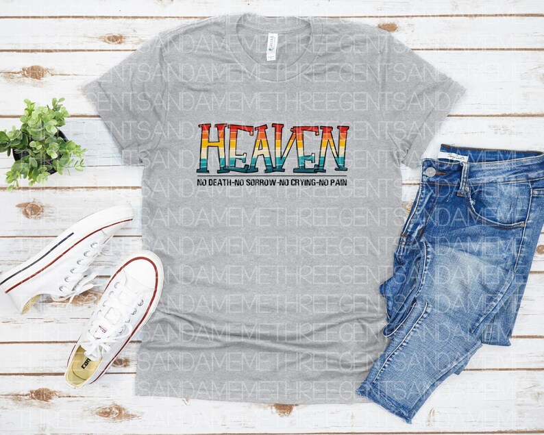 May include: A gray t-shirt with a rainbow-colored graphic that says "HEAVEN" and "NO DEATH-NO SORROW-NO CRYING-NO PAIN".