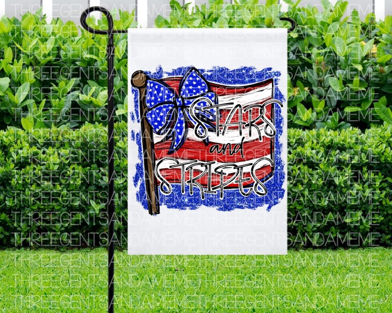 May include: A white garden flag with a red, white, and blue American flag design. The flag has a blue bow and the text "Stars and Stripes" in a white, blue, and red font.