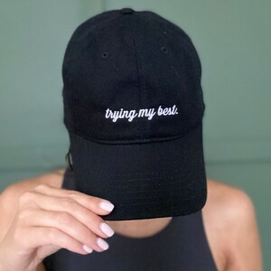 100% Organic Cotton, black baseball cap, embroidered "trying my best" women's cap