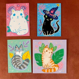 Gatto carino con pianta Cartolina, magia