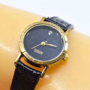 Gold tone with black dial, womens watch