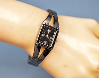 Black tone, women's fashion , cuff watch