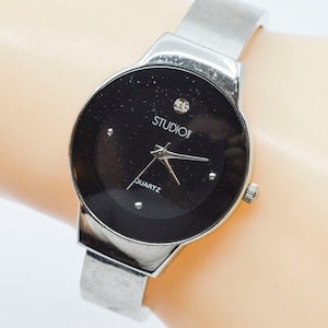 Silver and black tone womens cuff watch