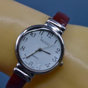 Silver and red tone, womens, cuff watch