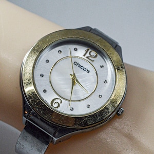 Steel and gold tone womens cuff watch