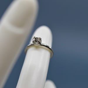 Silver tone with crystal, womens ring,size 1/2