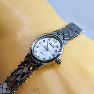 Silver tone with mop dial womens fashion watch
