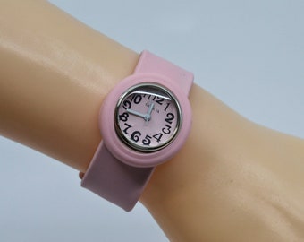 Pink tone wih silicone wrap around band womens watch