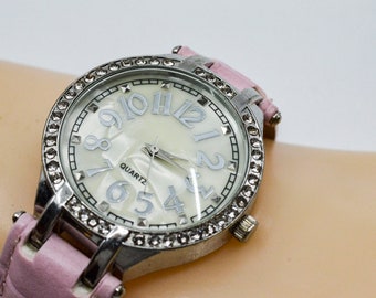 Silver tone with crystals and mop dial womens fashion watch