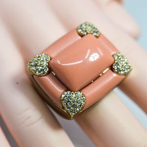 Gold tone with pink and crystals ornament womens large ring,size 6 1/2