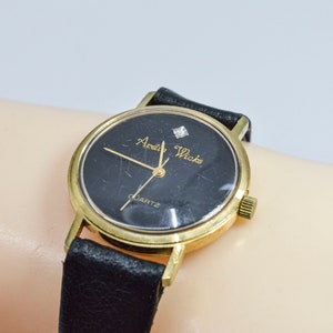 Ardie Wicks gold tone with black dial vintage quartz womens wrist watch