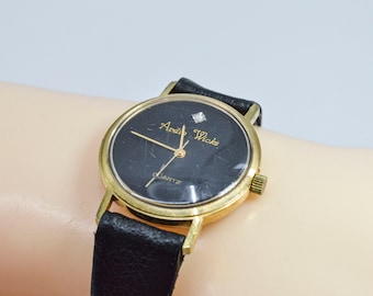 Ardie Wicks gold tone with black dial vintage quartz womens wrist watch