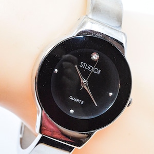 Silver tone with black dial womens cuff watch