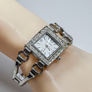 Silver tone with crystals womens cuff watch