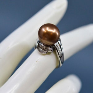 Silver tone with crystals, bronze tone, faux pearl bead, womens ring,size 7 1/4