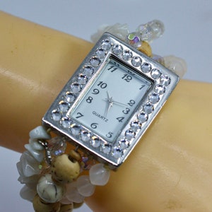 Ssilver tone with crystals womens fashion watch on stretch , beaded bracelet