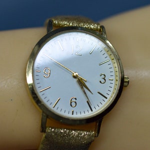 Gold tone with white dial, womens fashion watch
