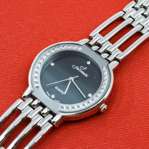 Steel tpne with black dial womens fashion watch