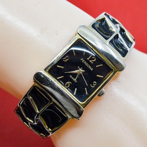 Persona gold and black tone womens fashion watch