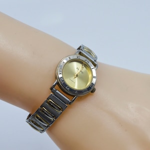 Two tone womens fashion watch on stretch bracelet