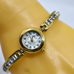 Gold tone with mop dial, womens fashion watch