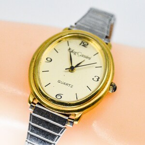 Oleg Cassini Gold ton mit goldenem Ziffernblatt und silberfarbenen Stretch Armband DamenUhr