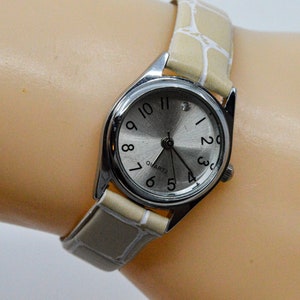 Silver tone with silver dial womens watch