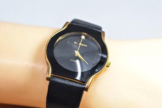 Black and gold tone womens wrist watch - image 1