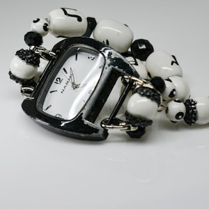 Black tone extra large womens fashion watch with beaded bracelet