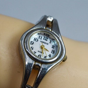 Silver tone with mop dial womenswrist watch