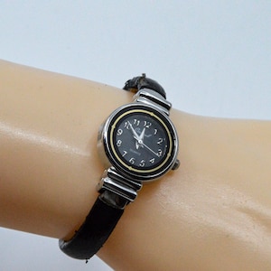 Silver and black tone womens cuff watch - 5 or less inch wrist