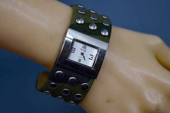 Silver and green tone, womens cuff watch - image 1