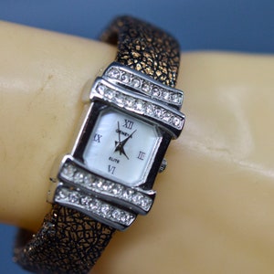 Silver tone with crystals, womens cuff watch