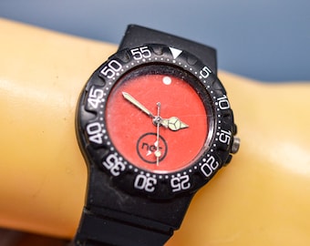 Black tone with red dial, plastic , sports wrist watch