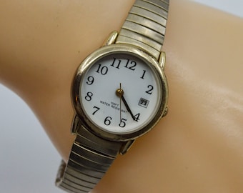 Gold tone with white dial womens quartz watch on stretch bracelet