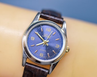 Silver tone with blue dial, womens watch