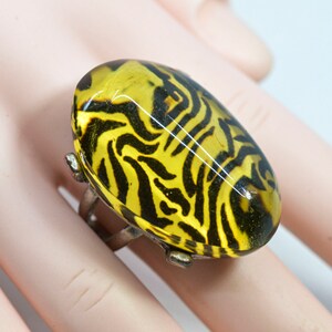 Silver otne with large yellow lucite ornament womens ring,size 7 1/2