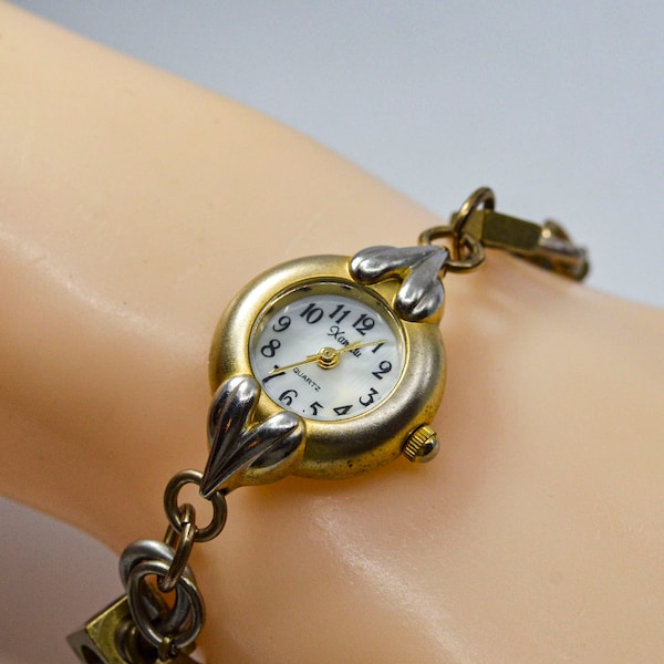 Xanadu gold tone womens fashion charm bracelet watch