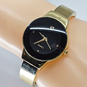 Gold tone womens cuff watch