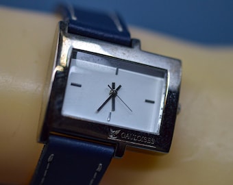 Silver tone with white dial, blue bracelet, womens, watch
