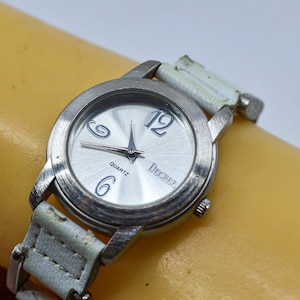 Silver tone , womens, fashion watch on white bracelet