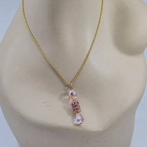 Gold tone with pink pendant womens necklace