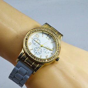 White and gold tone womens cuff watch