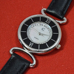 Steel and black tone with mop dial womens fashion watch