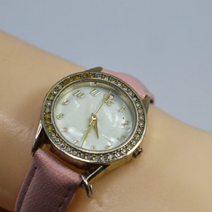 Gold tone with crystals and mop dial womens fashion wrist watch