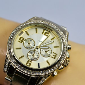 Gold tone with crystals womens fashion watch